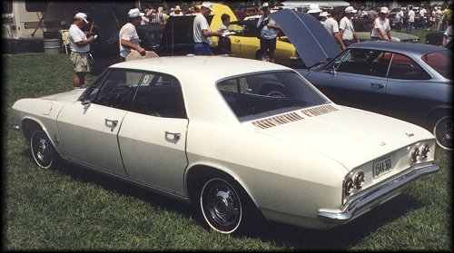 1965 Corvair Monza sport sedan (rear 3/4 view)