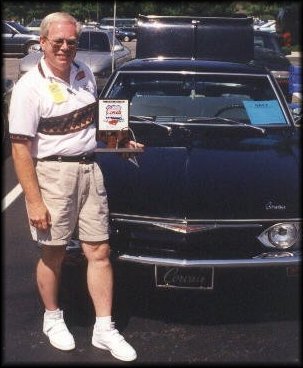 Bob Norwalk with his '65 Monza and award